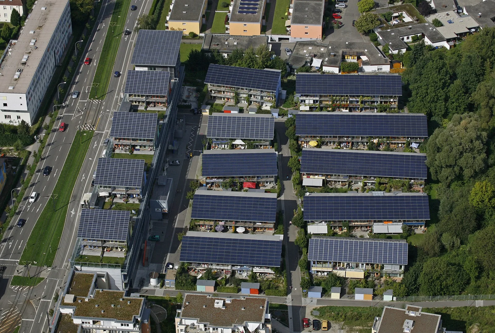 Aerial view of the Solar Settlement in Freiburg Vauban, rows of photovoltaic roofed homes between green strips