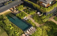 Aerial view of the long pool, timber deck and roof gardens between dark wings of the house, Vista House by Studio Gontijo Arquitetura